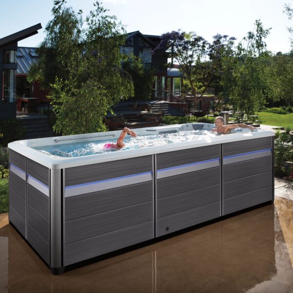 endless pools ultimate swim spa EP FitnessSystems 2023 E500 IceGray Gray Lifestyle Female Swimmer