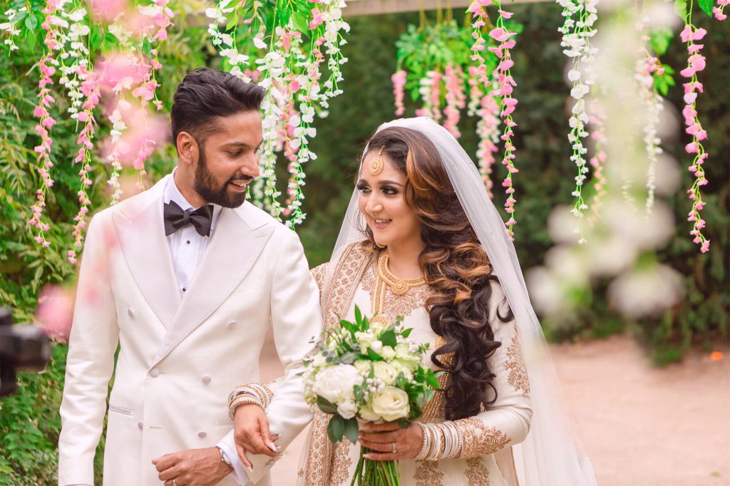 A wedding couple together in the garden